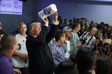Trump tosses paper towels to hurricane victims.